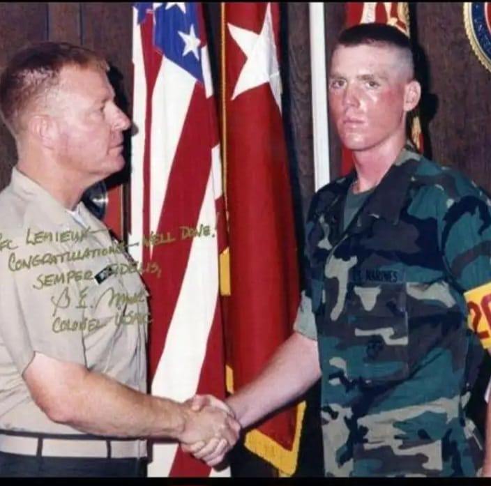 Young DJ Natural Nate® in USMC camouflage shaking hands with a Colonel, signed congratulations photo